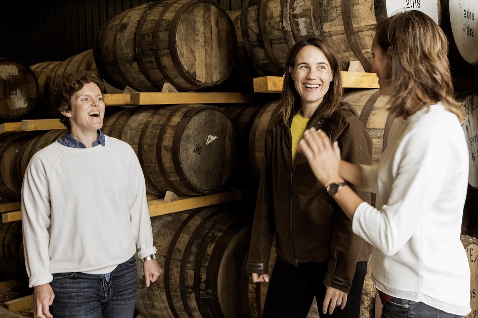 Nc'Nean Team laughing in the stockhouse producing ecological whisky